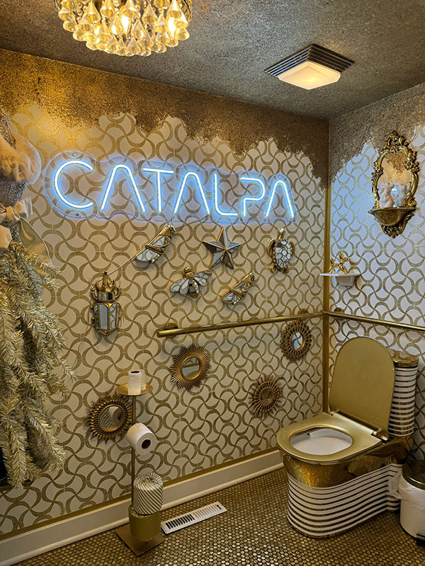 The restroom at Catalpa is bedecked in gold colors. Even the toilet.