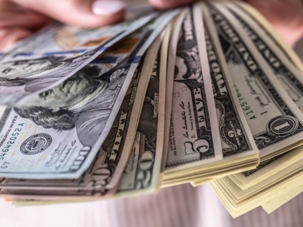 holding money out in a fan