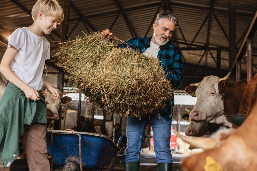 kid-helping-dad-with-farm-chores