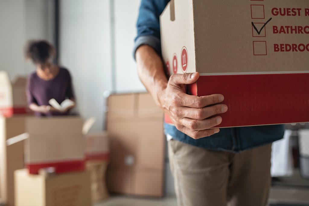 man-holding-moving-box
