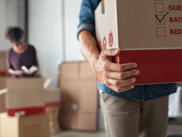 man-holding-moving-box