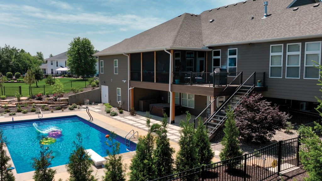 exterior of a house with a deck and pool