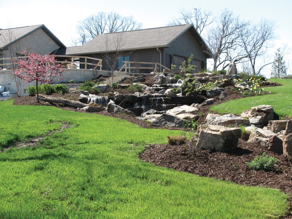 home exterior, large rocks in yard