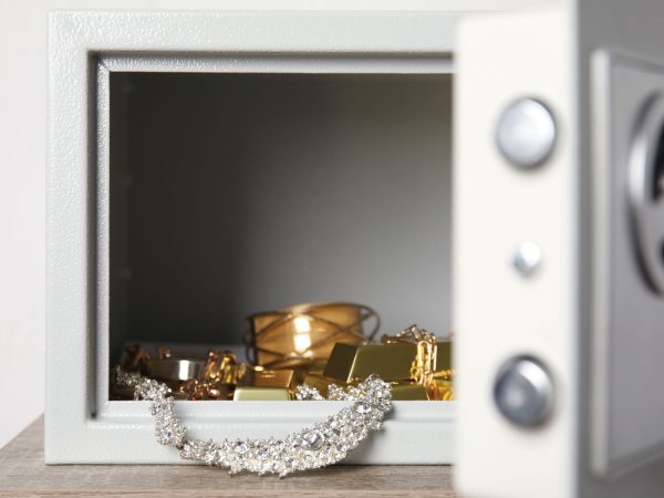 valuable-jewelry-being-locked-away-in-a-safe