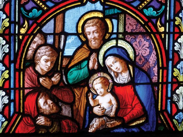 Cathédrale Sainte Bénigne - Dijon, FRANCE - 01-30-2025: Stained glass (19th century) of Christmas Nativity Scene with Virgin Mary, Saint Joseph, and Jesus baby.