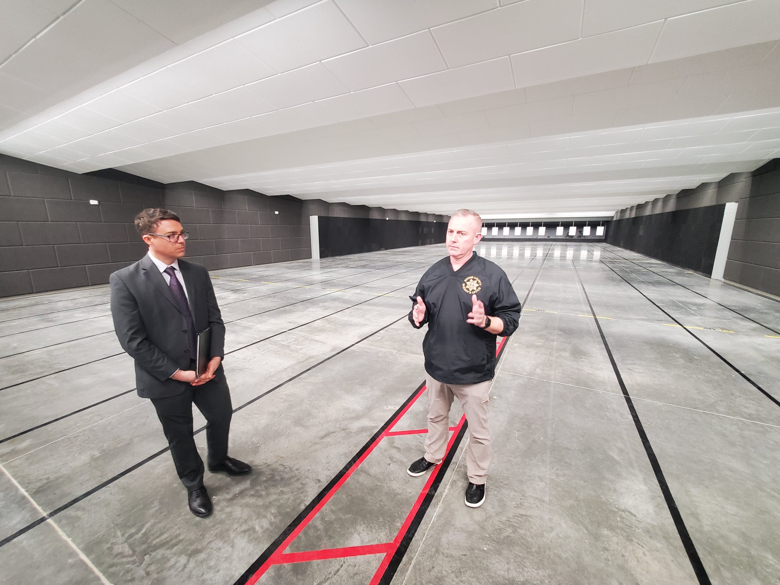 Boone County Presiding Commissioner Kip Kendrick and Capt. Brian Leer of the Boone County Sheriff's Office show off the training center's firing range.