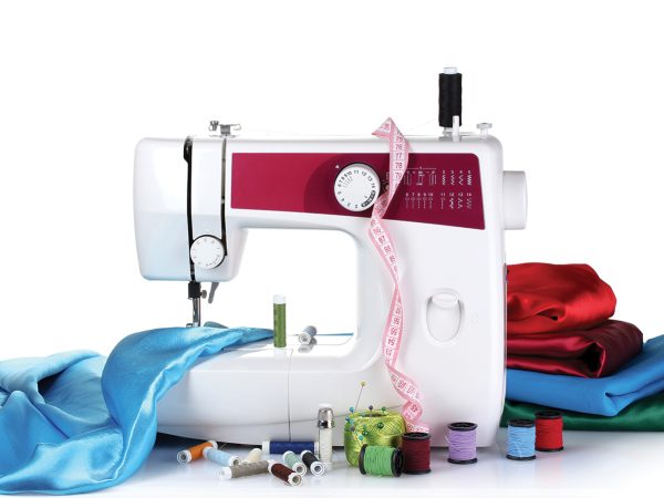 sewing machine and fabric isolated on white