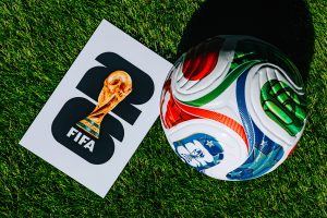 Official FIFA World Cup 2026 Match Ball on Pitch and official logo