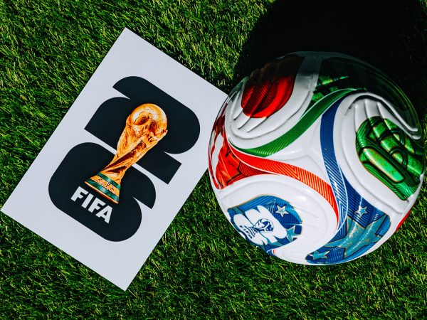 Official FIFA World Cup 2026 Match Ball on Pitch and official logo